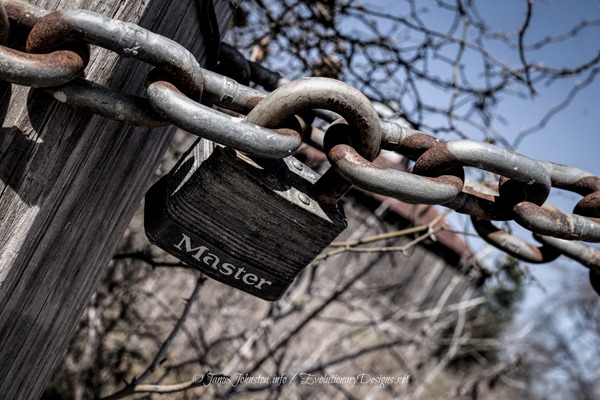 On Lock Down - Padlock and Rusty Chain